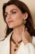 Gold heart drop earrings with a smaller heart above a larger heart.