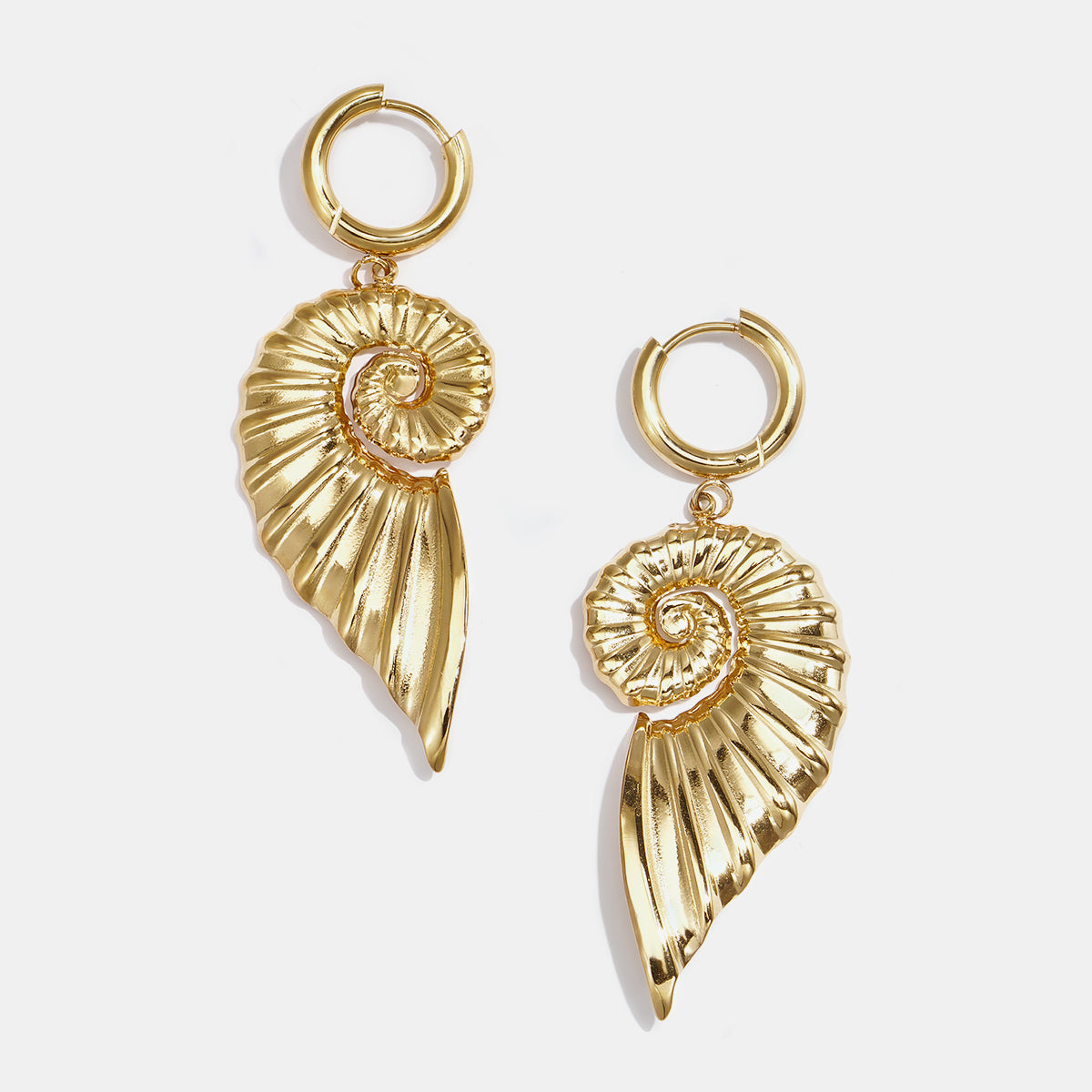 Gold-toned hoop earrings with dangling spiral shell charms.