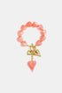 Pink heart beaded bracelet with gold heart charms and a pink heart dangle.