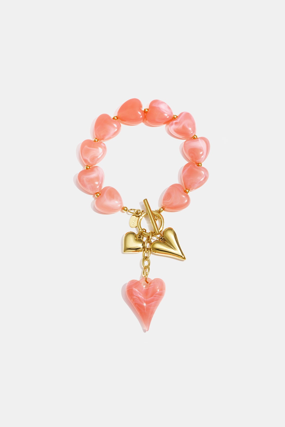 Pink heart beaded bracelet with gold heart charms and a pink heart dangle.