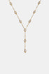 Gold Y-shaped necklace with a chain of small beads and circular pendants, each with a clear stone.