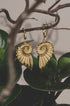 Gold-plated stainless steel hoop earrings shaped like spiral shells with intricate detailing.