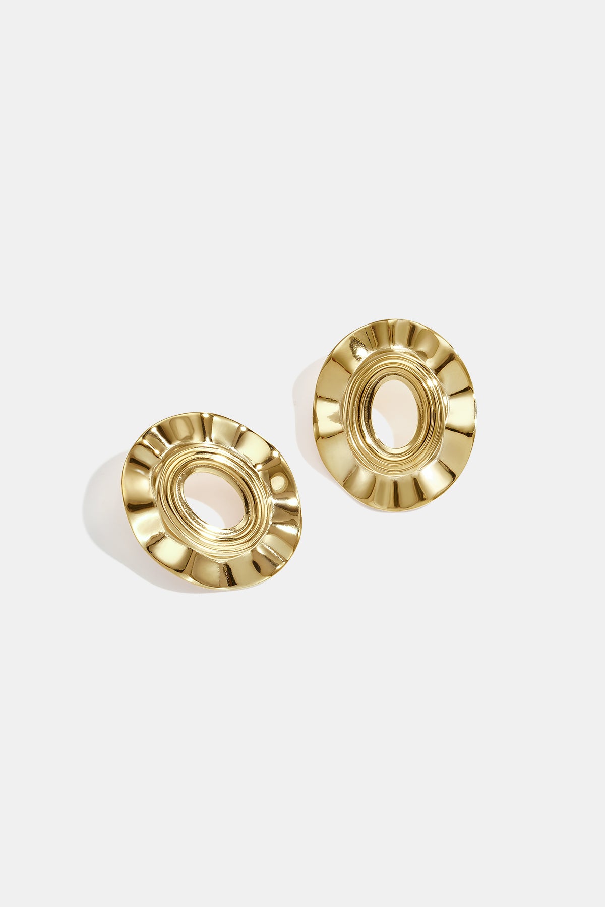 Pair of gold-plated irregular shape stud earrings with a textured, circular design.