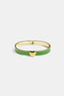 Gold bangle with green enamel and a gold heart charm.