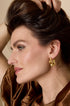 Gold celestial star hoop earrings with a unique, abstract shape.