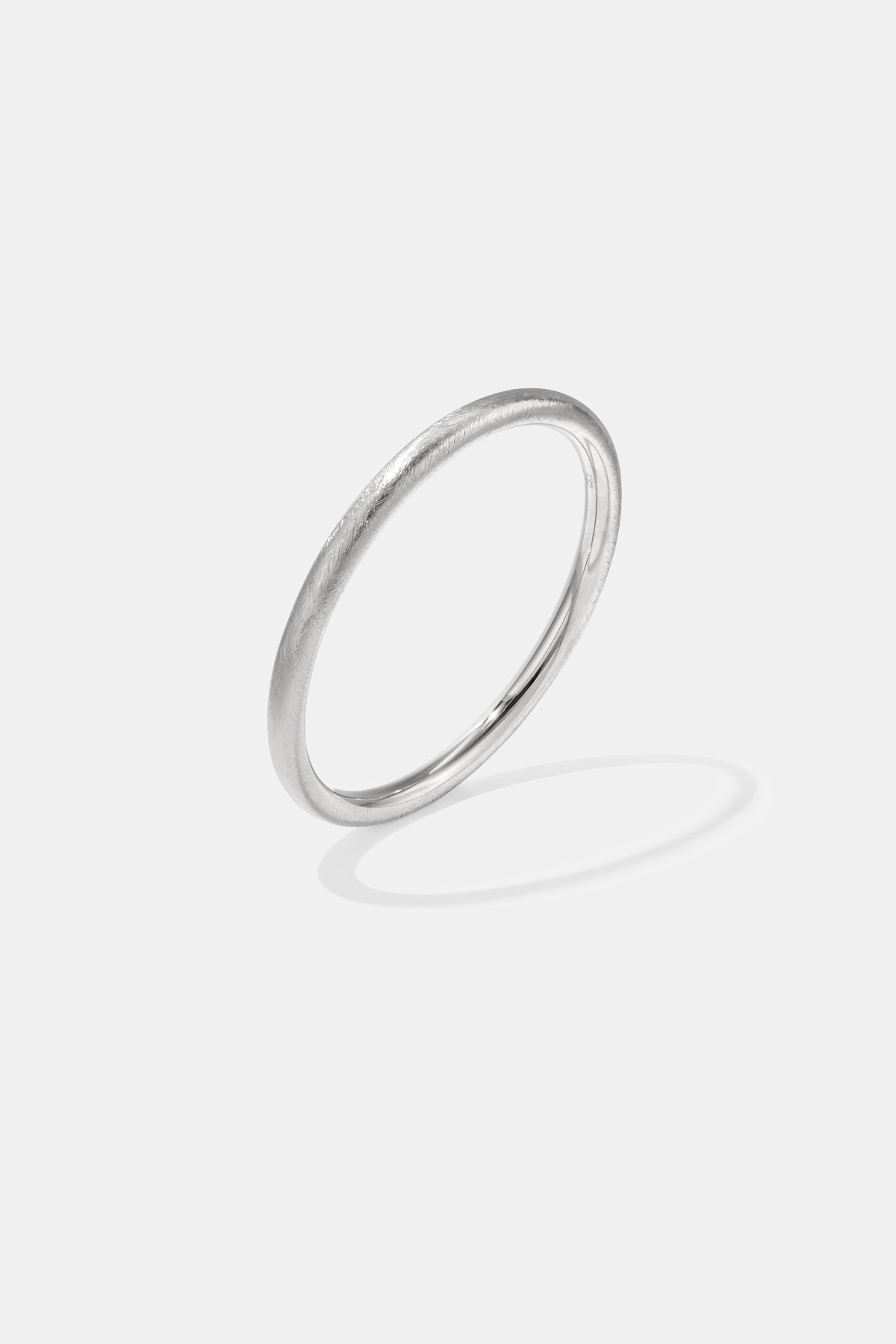 Elara Bangle Bracelet in silver, 6 mm wide with a brushed finish.