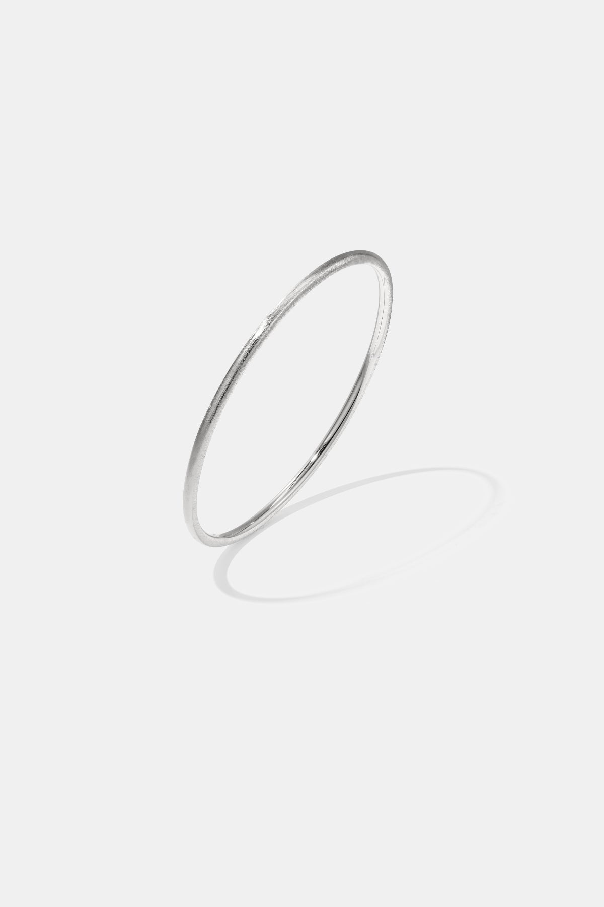 Silver Elara Bangle Bracelet, 3 mm wide with a brushed finish.