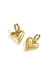 Gold heart drop earrings with a brushed finish, attached to gold hoops.