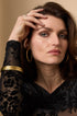 Elara Bangle Bracelet in gold, 6 mm wide, made of stainless steel with PVD coating.