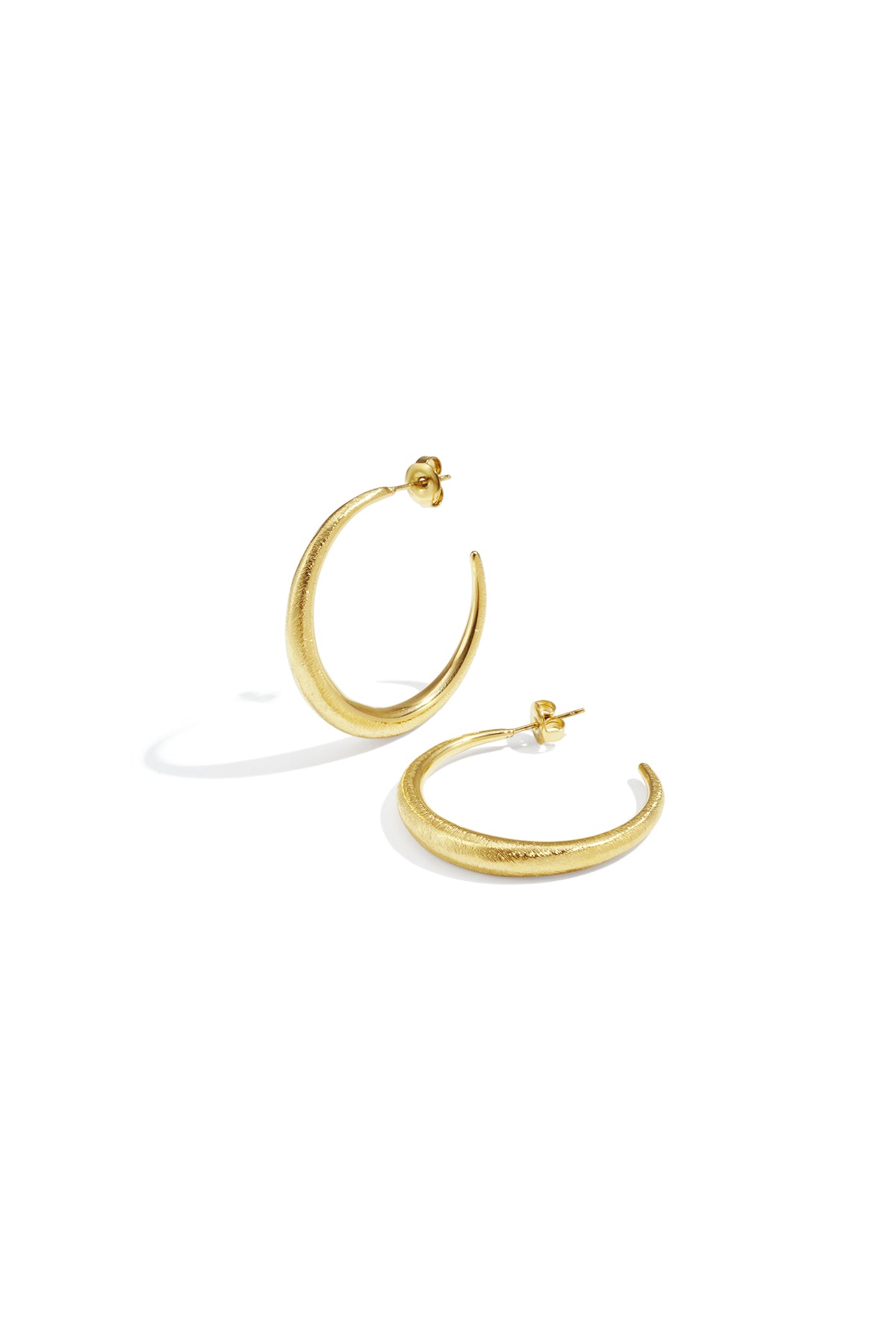Aurelia Hoop Earrings: A pair of brushed gold-toned hoop earrings with stud backs.