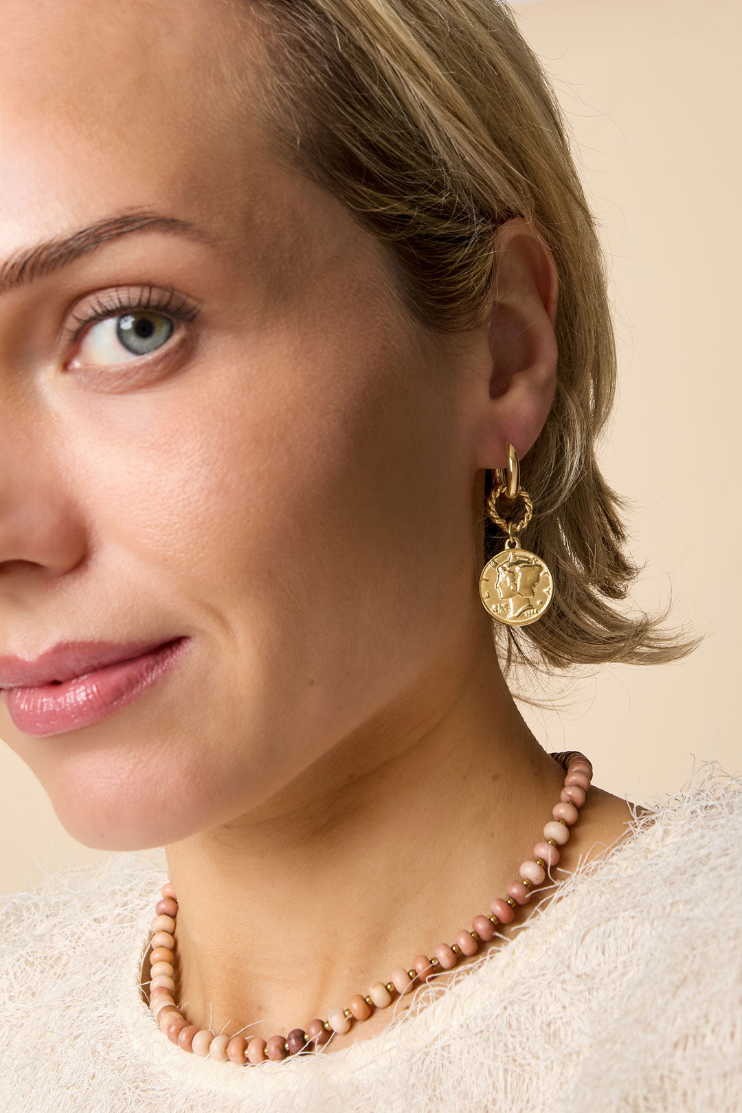 Gold Elysian drop earrings with coin pendant and beaded necklace.