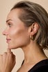 Aurelia Hoop Earrings: Gold-toned, heart-shaped hoop earrings with a shiny finish.