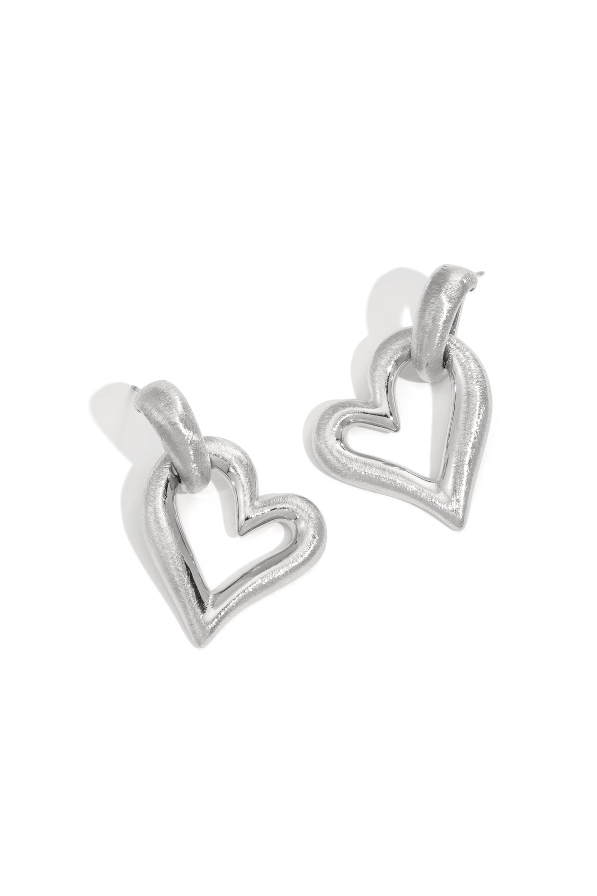 Silver heart drop earrings with a brushed finish.