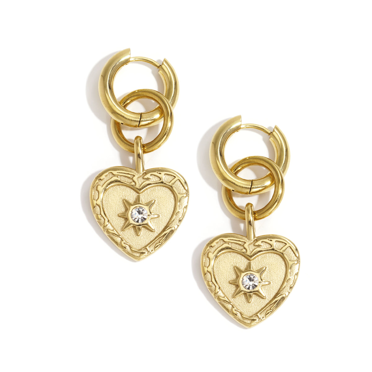 Gold heart drop earrings with a starburst rhinestone accent and double hoop detail.