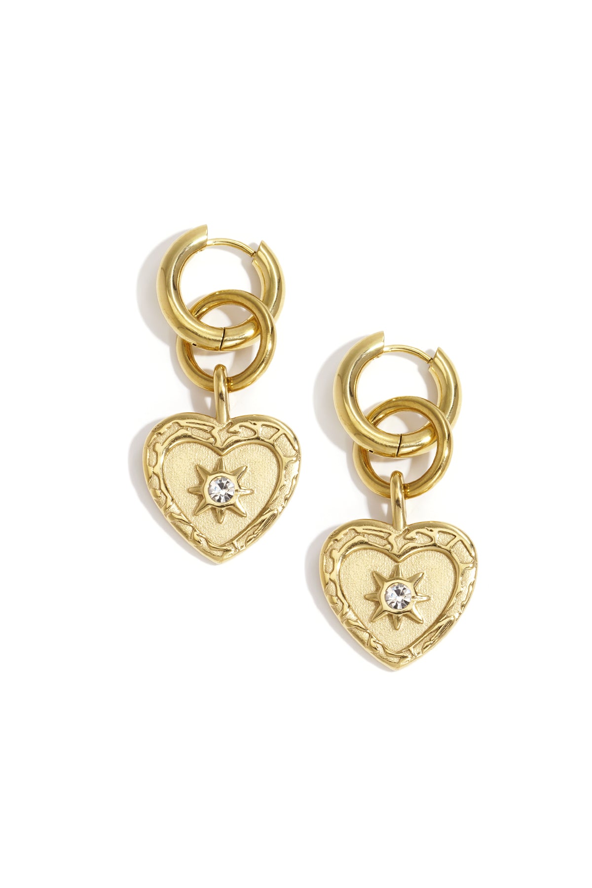 Gold heart drop earrings with a starburst rhinestone accent and double hoop detail.