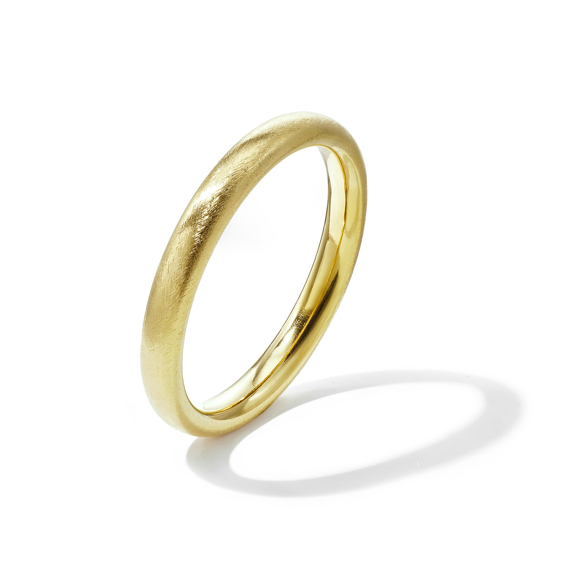 Gold-toned stainless steel bangle with a brushed finish and a polished inner surface.