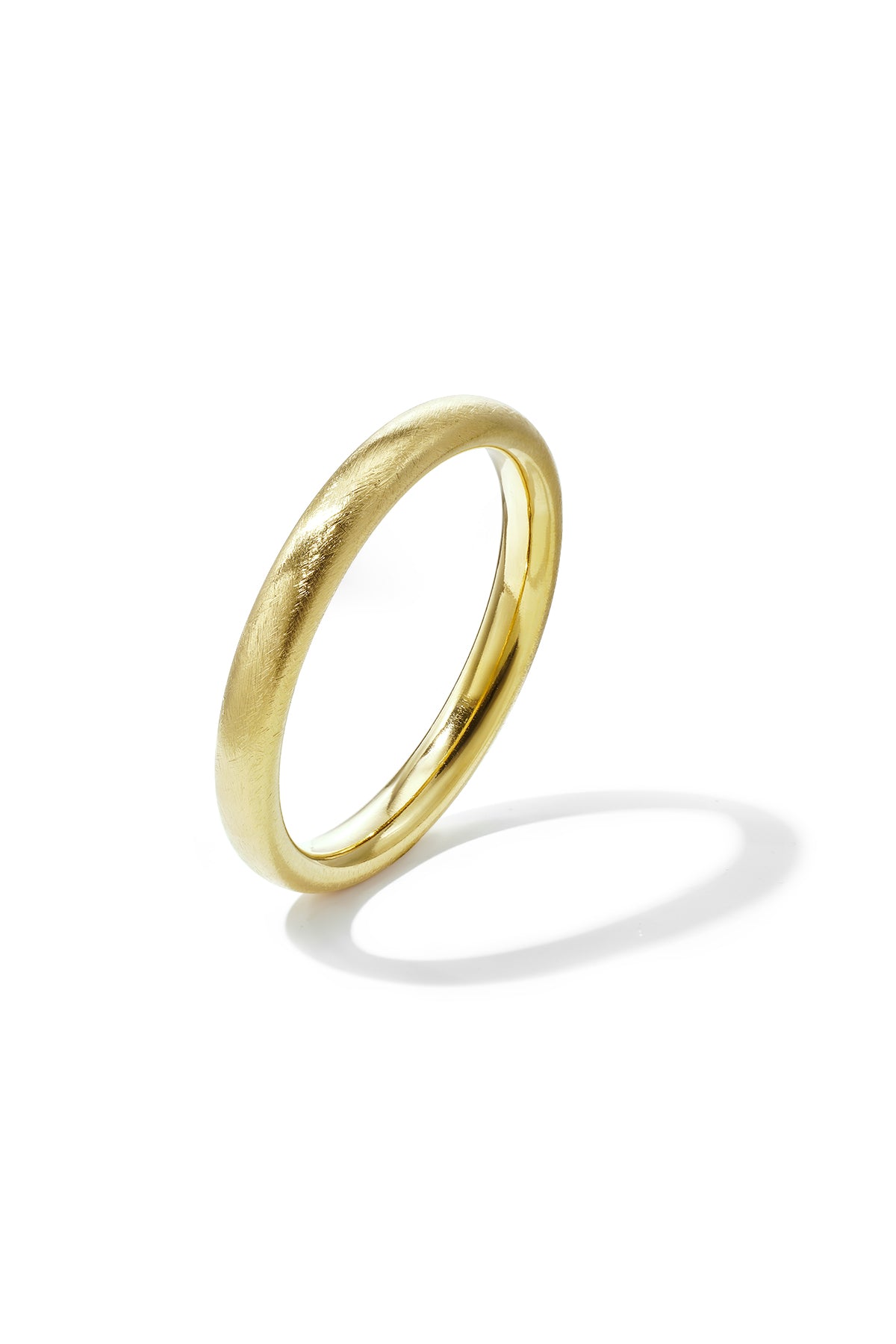 Gold-toned stainless steel bangle with a brushed finish and a polished inner surface.