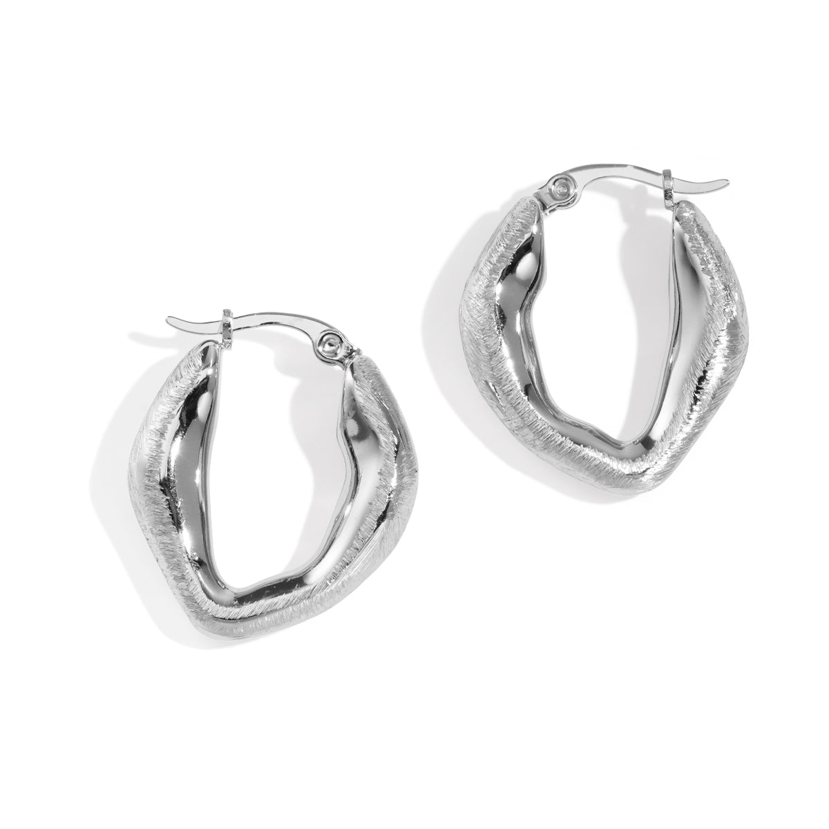 Aurelia Hoop Earrings in silver with a textured, wavy design.