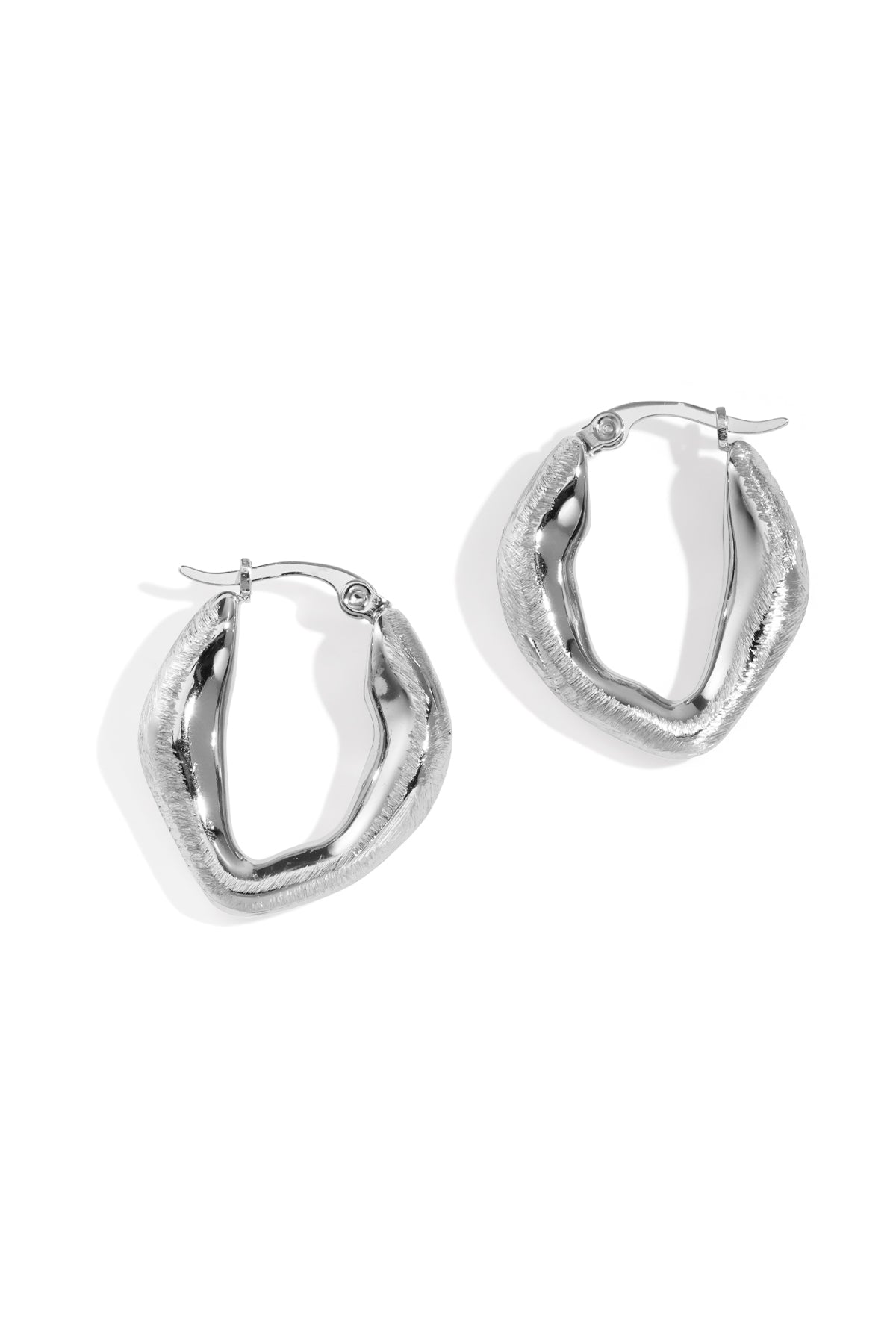 Aurelia Hoop Earrings in silver with a textured, wavy design.
