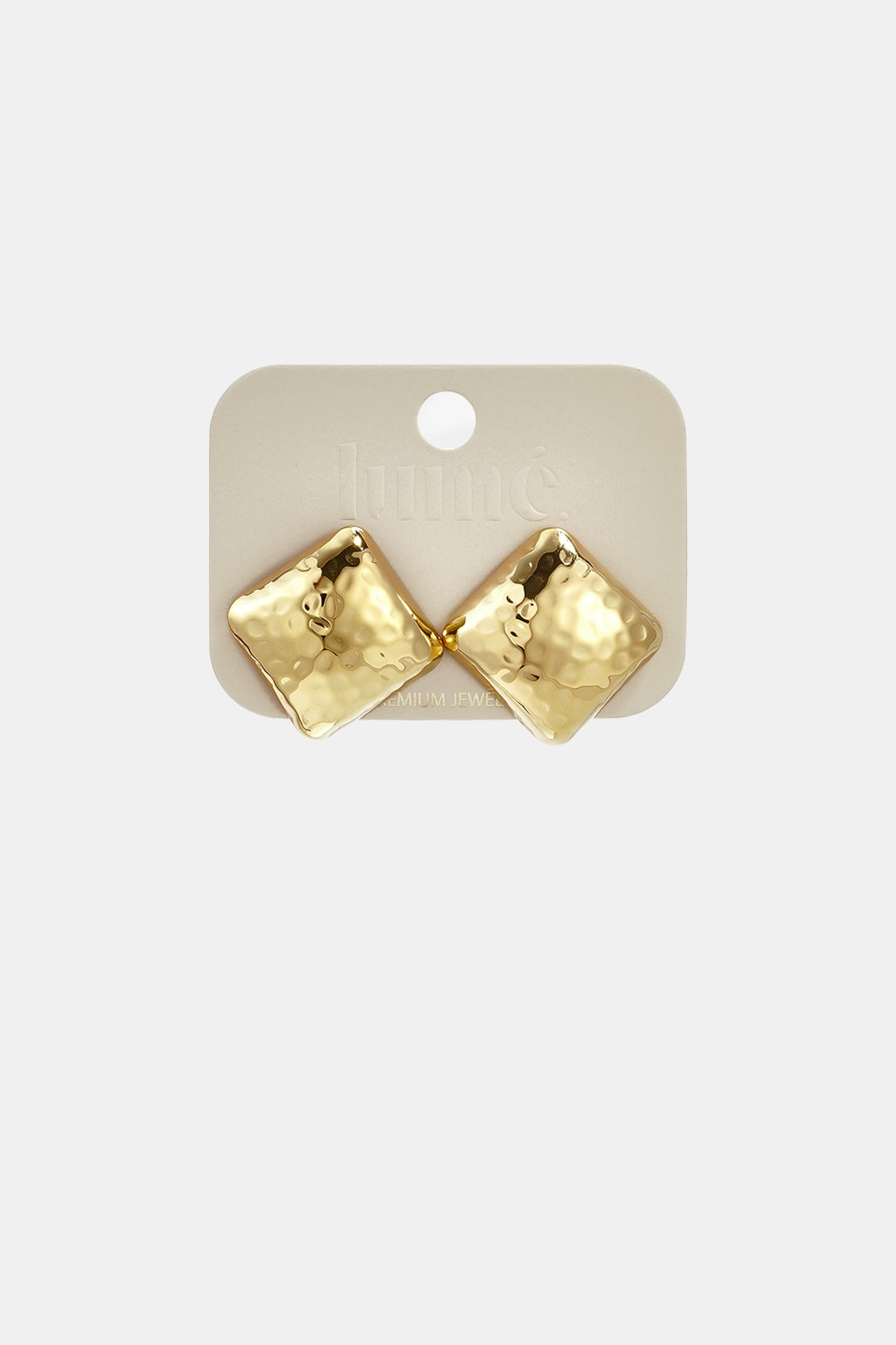 Gold square stud earrings with a hammered texture on a light beige card.