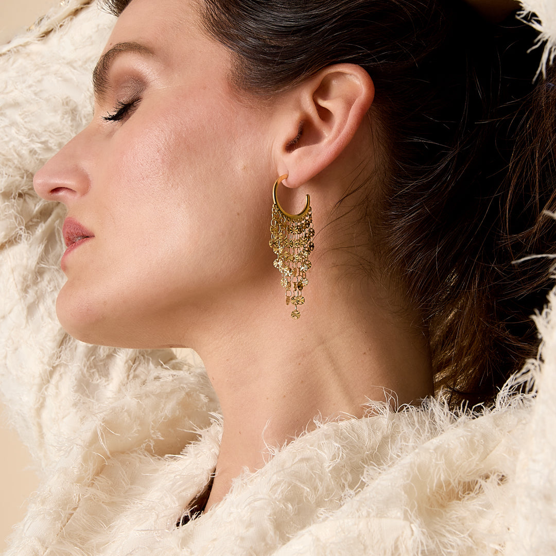 Gold tassel dangle earrings with multiple layers of delicate tassels.