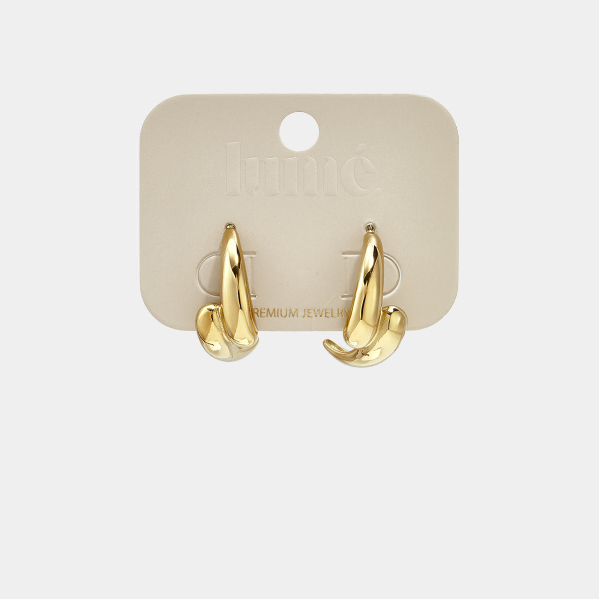 Gold irregular hoop earrings on a beige card with 'premium jewelry' text.