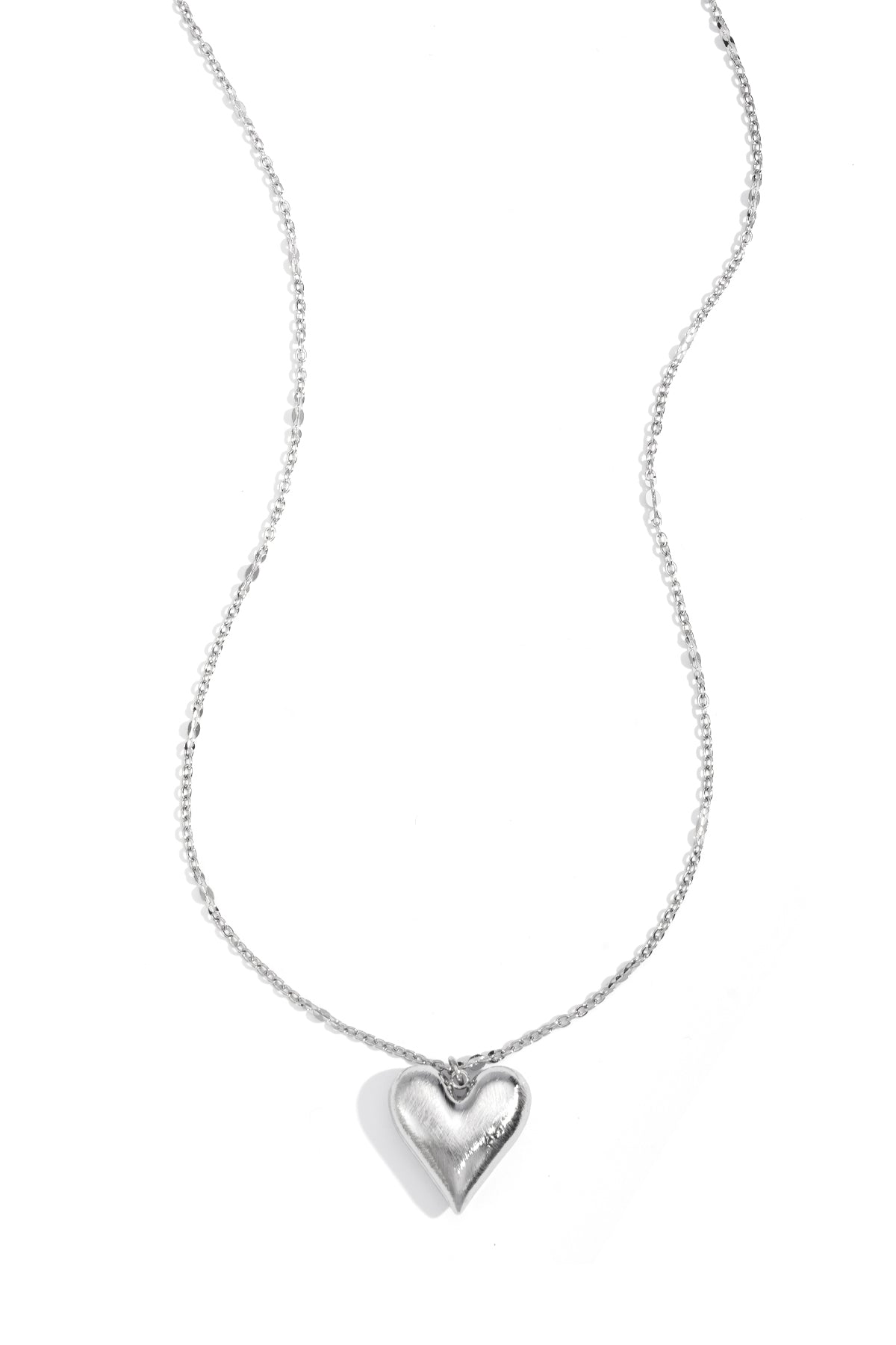 Silver heart pendant necklace with an adjustable chain.