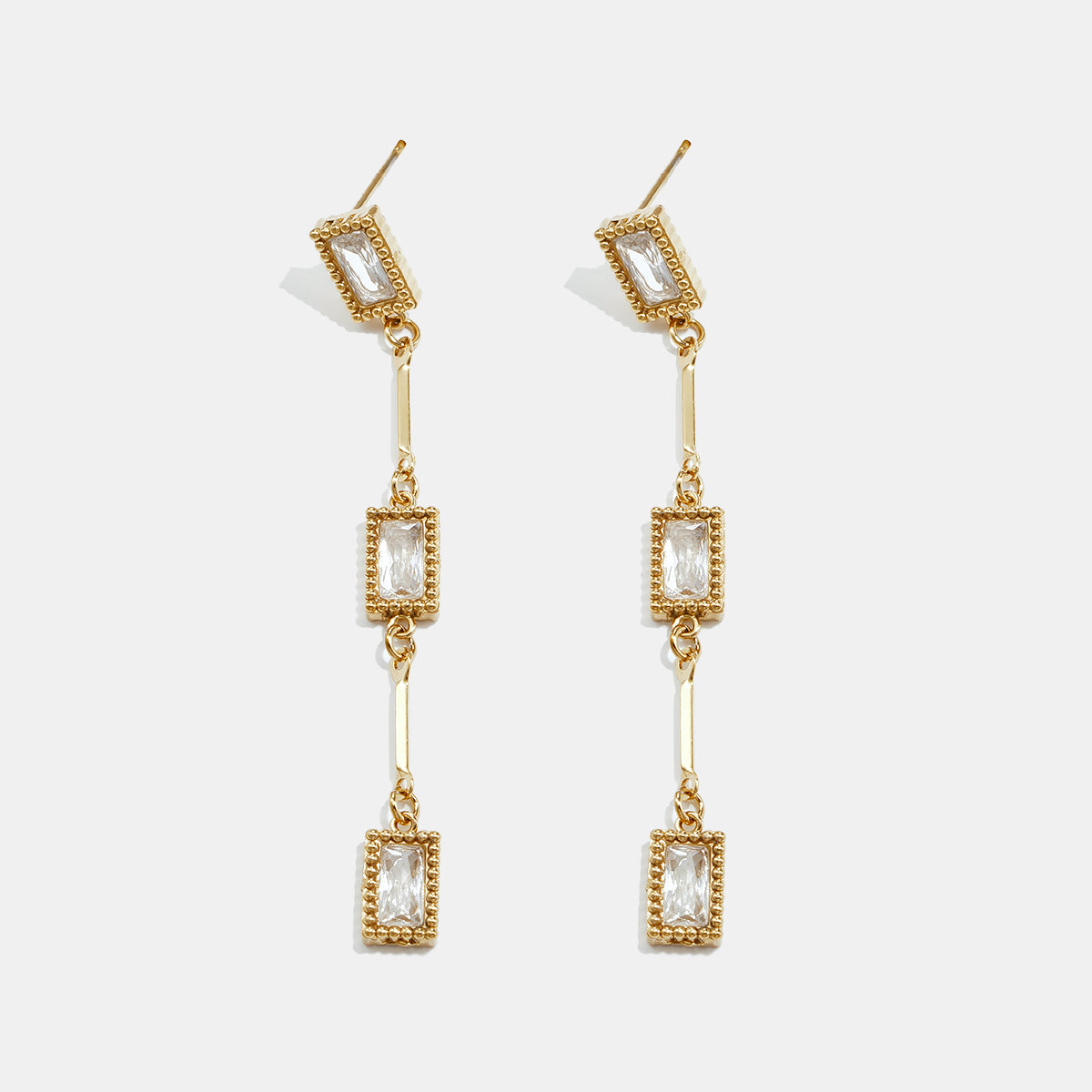 Gold Elara geometric earrings with three rectangular zircon drops.