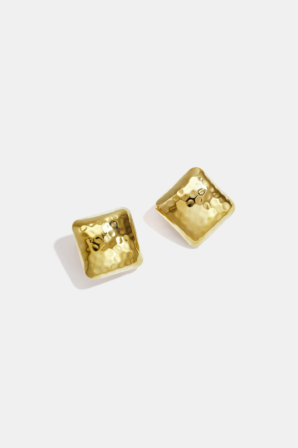 Gold Aurelia stud earrings with a hammered, square-like design.