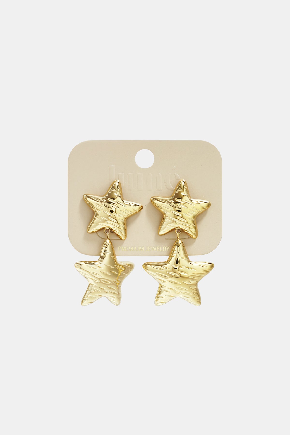 Gold celestial star drop earrings on a beige card with "PREMIUM JEWELRY" printed on it.