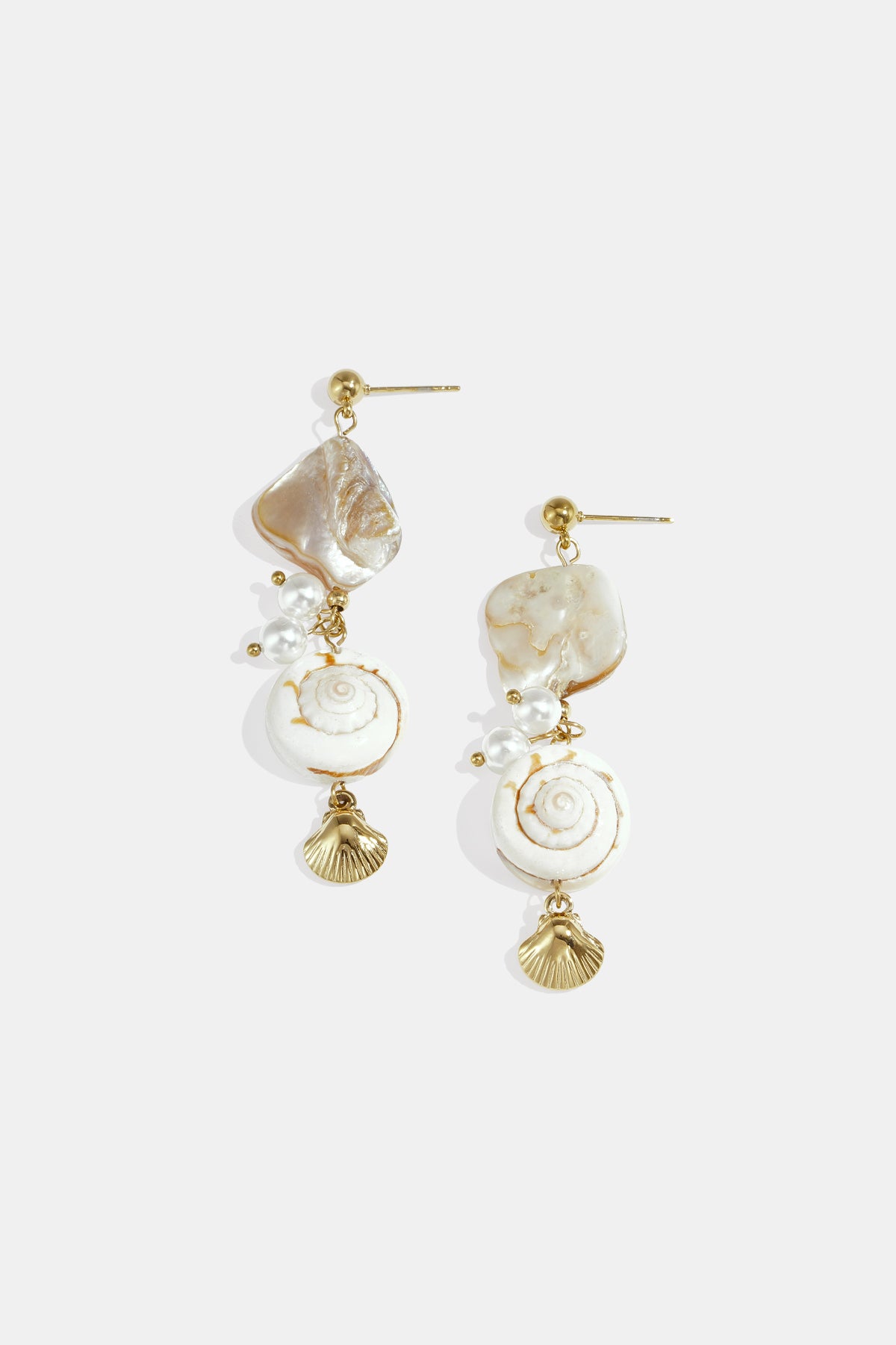 Gold dangle earrings with shells, pearls, and spiral shell charms.