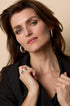 Aurelia Hoop Earrings in gold, worn by a model.