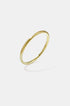 Elara Bangle Bracelet in gold, 5 mm wide with a brushed finish.
