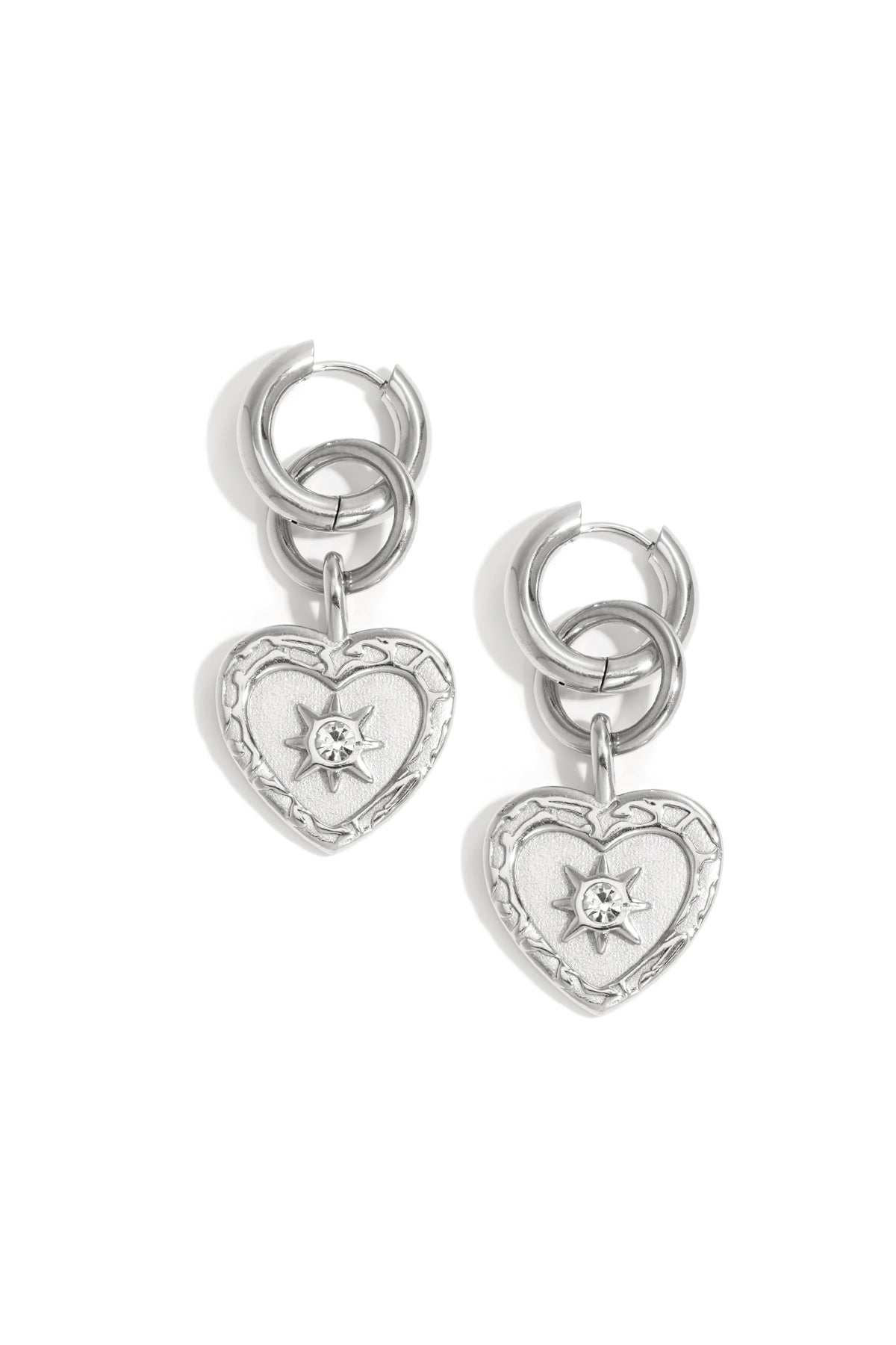 Silver heart drop earrings with a starburst rhinestone detail and double hoop.
