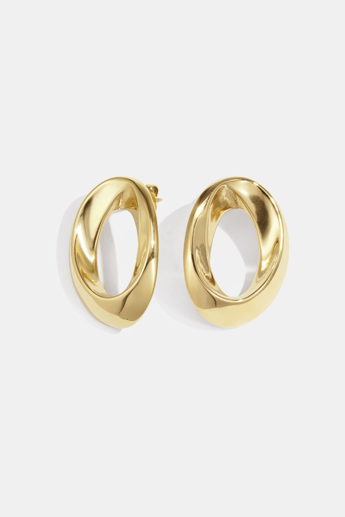Gold-toned Aurelia Circle Stud Earrings with a twisted, oval shape.