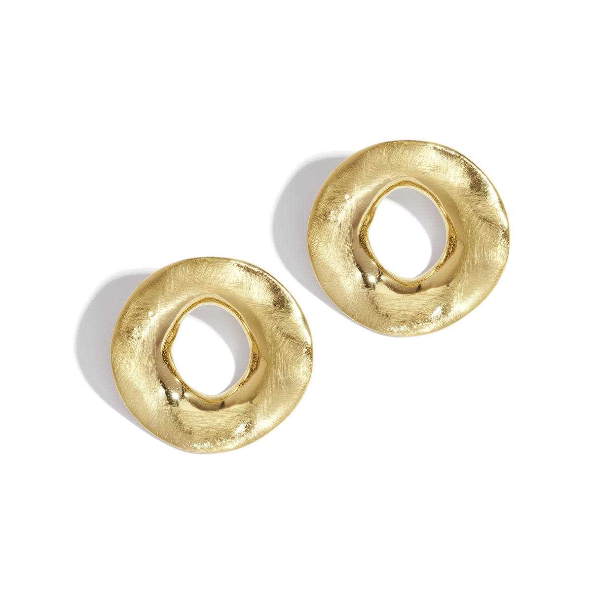 Two gold-colored, textured, circular Aura Statement Earrings on a white background.
