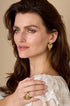 Gold stacked heart stud earrings with a textured finish.