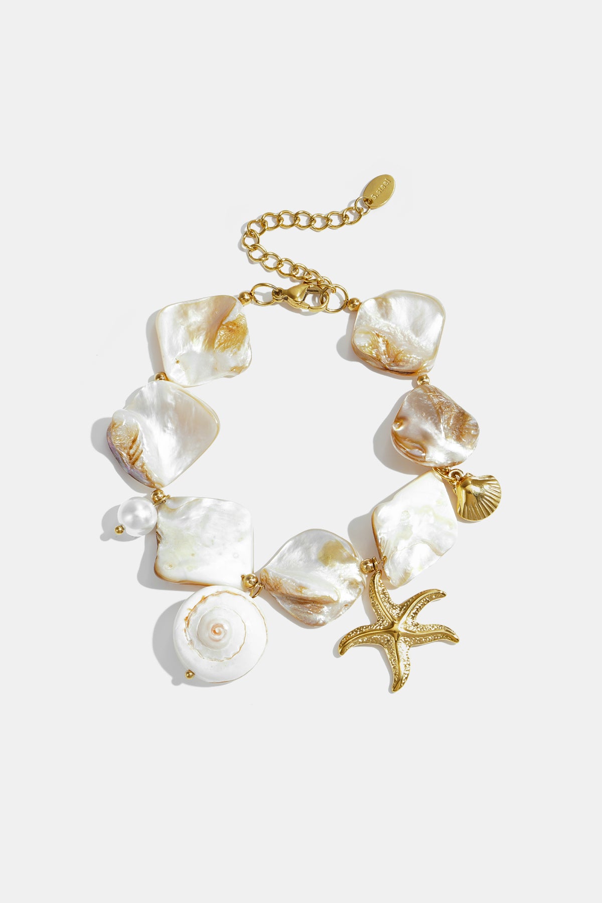 Ocean Charm Bracelet with shell, starfish, and pearl charms on a gold chain.