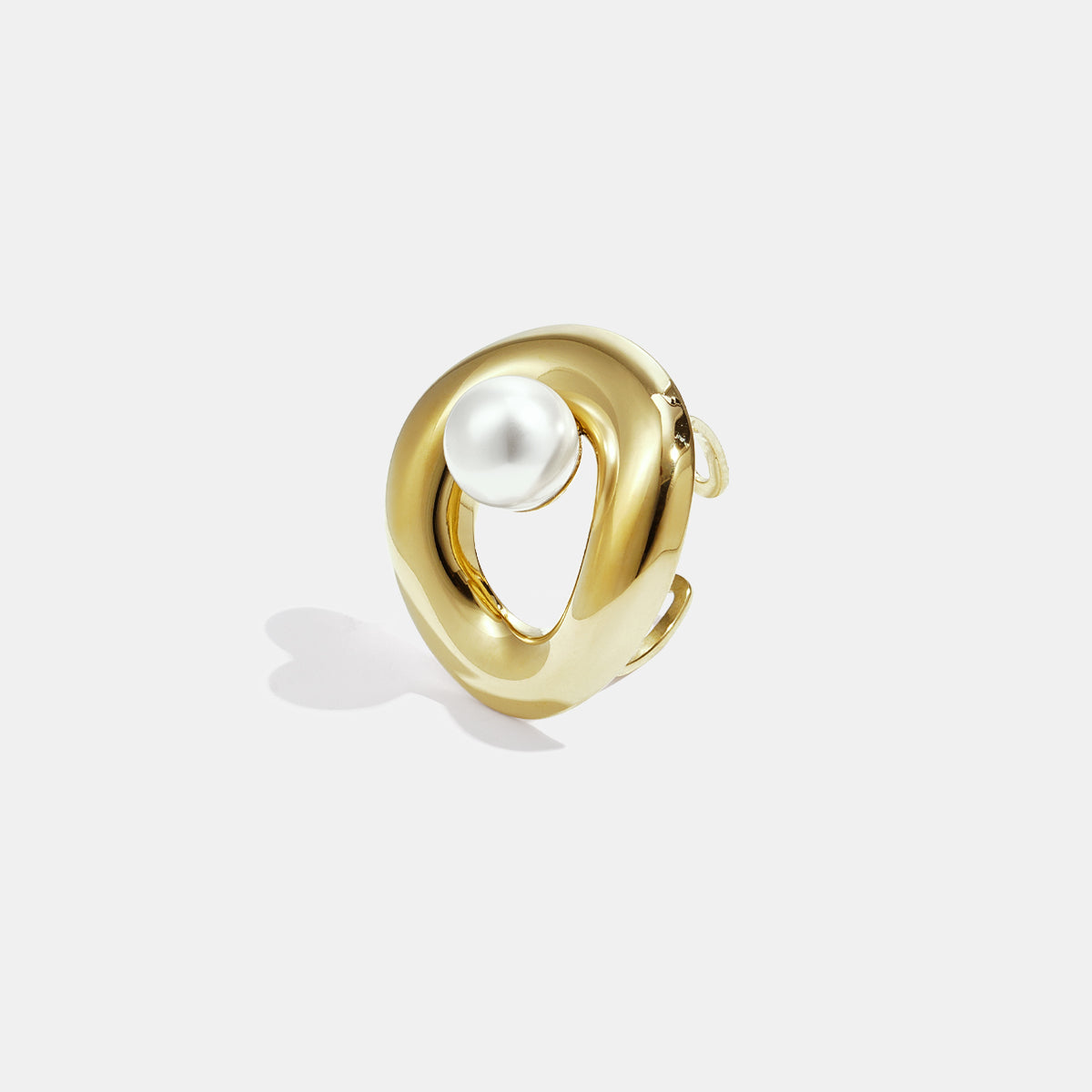 Gold-plated stainless steel ring with a pearl accent and an open circle design.