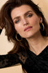 Astra Hoop Earrings: Gold-colored, 18K gold PVD coated 304S steel hoop earrings.