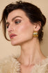 Gold Aurelia hoop earrings with a textured, leaf-like design.