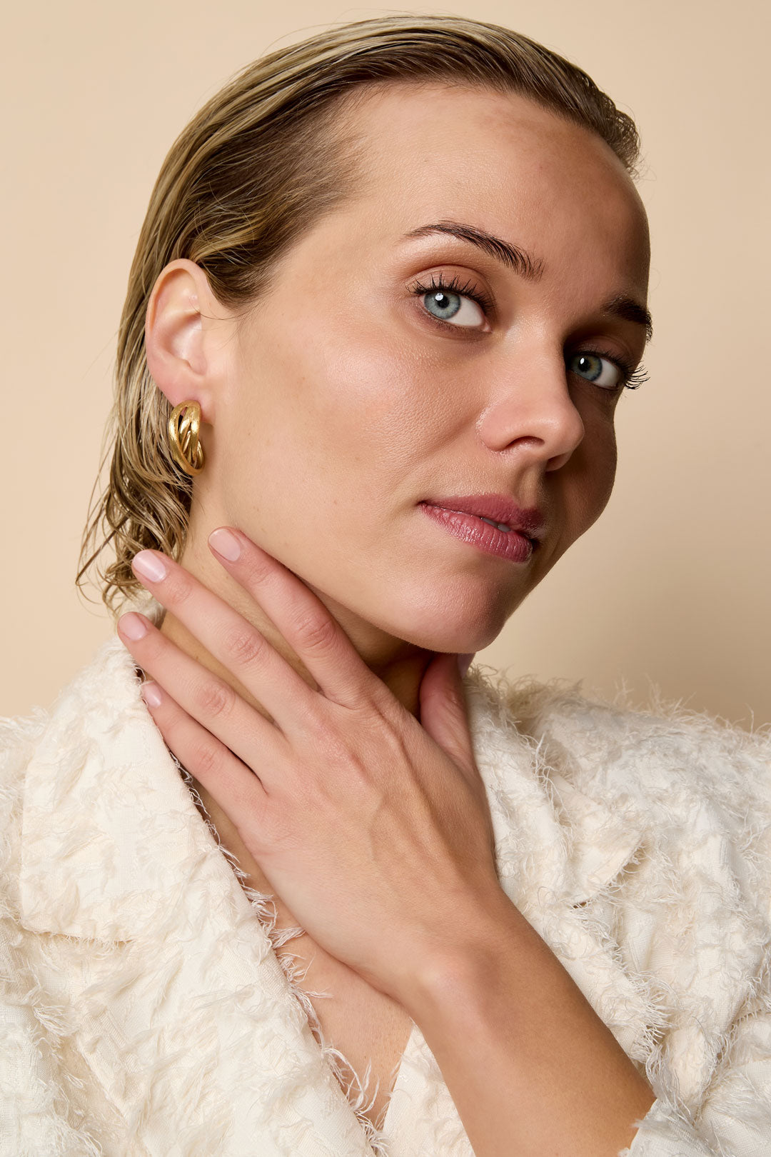 Astra Hoop Earrings: Gold-plated stainless steel hoop earrings with a textured finish.