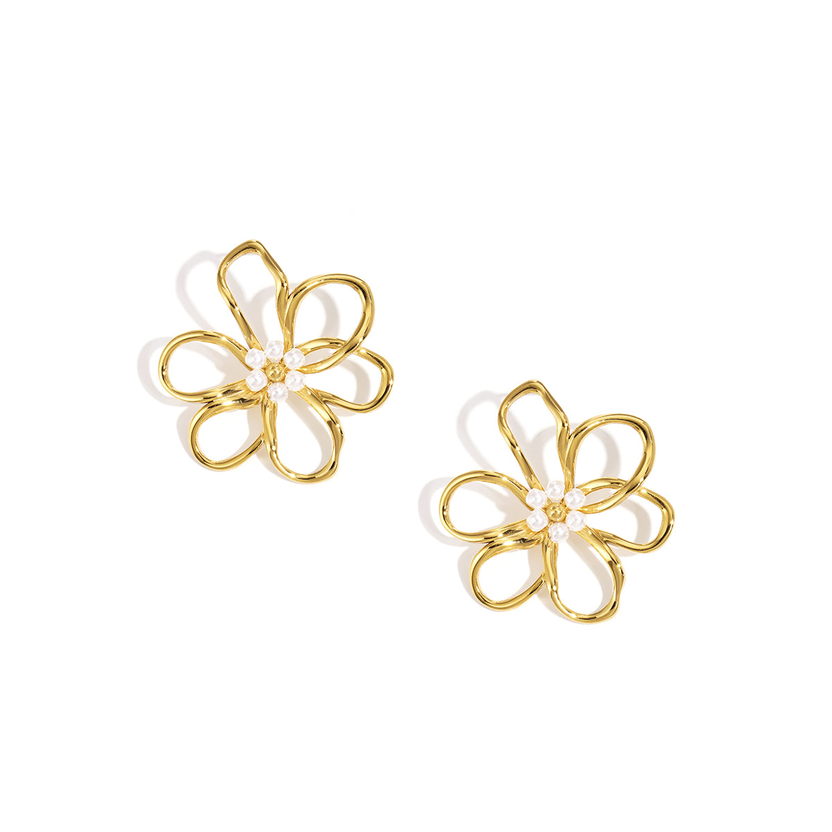 Gold flower stud earrings with small pearls in the center, on a white background.