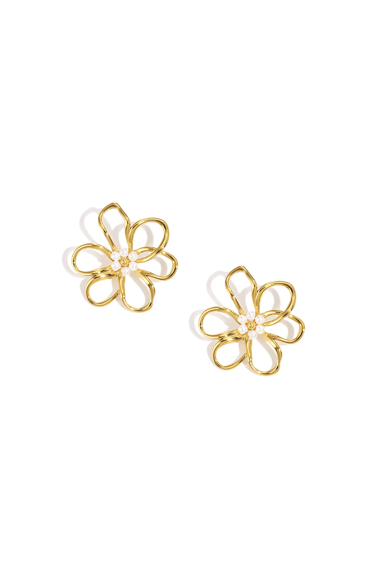 Gold flower stud earrings with small pearls in the center, on a white background.