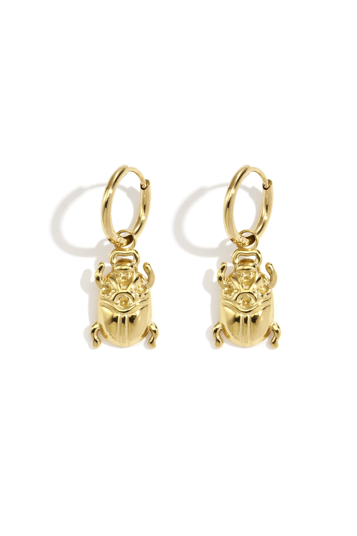 Gold-tone hoop earrings with dangling scarab beetle charms.