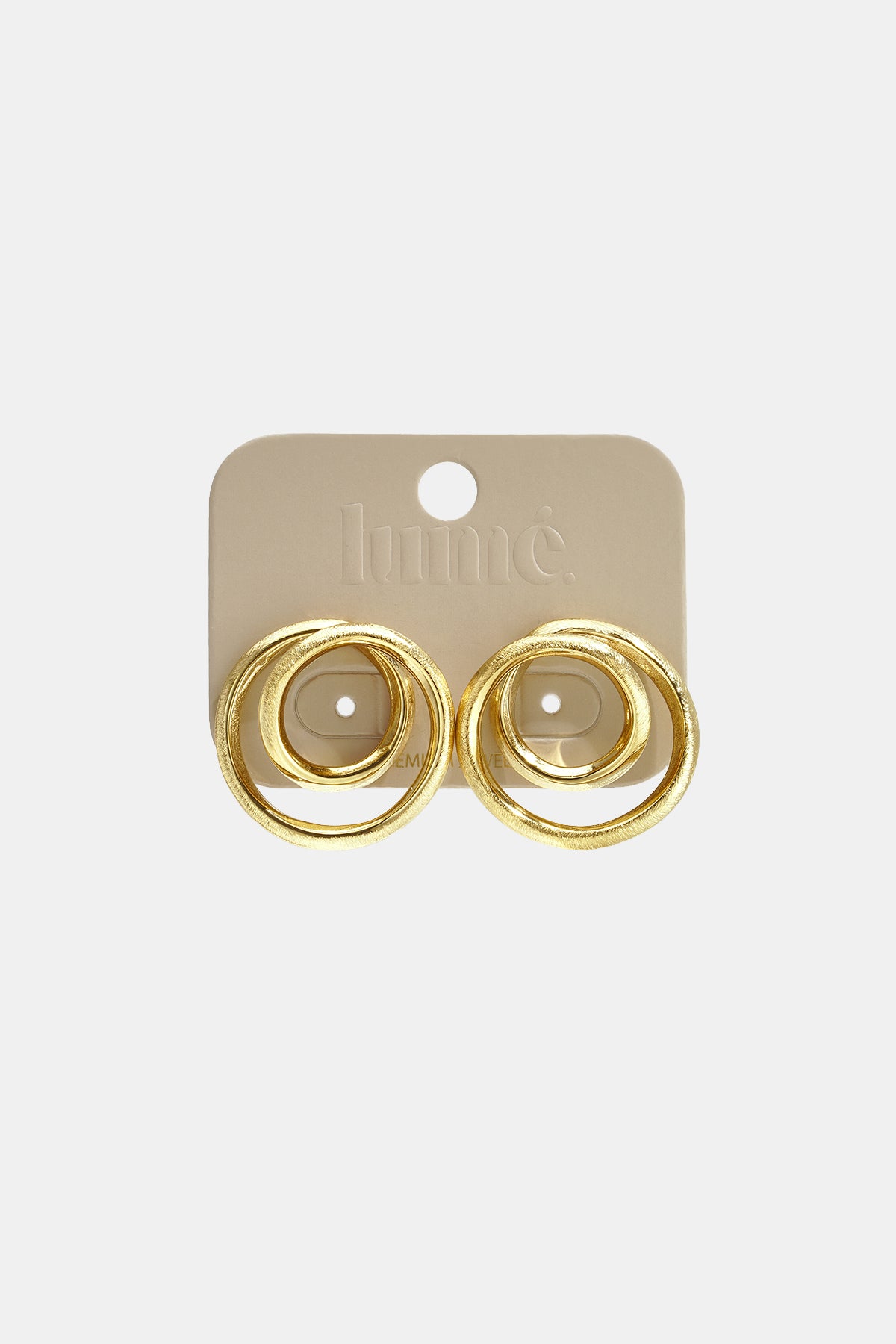 Gold spiral circle stud earrings on a beige backing card with the brand name 'lume.' visible.