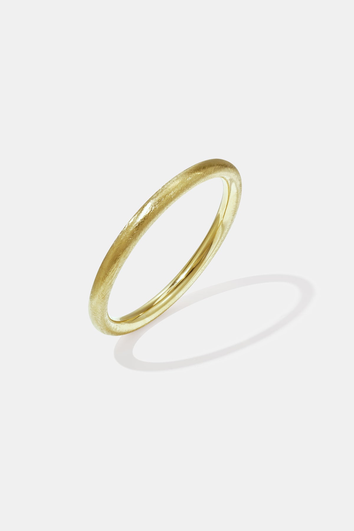Gold bangle bracelet with a brushed finish and 10 mm width.