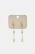Gold dangle earrings with three marquise-shaped clear stones on each earring.