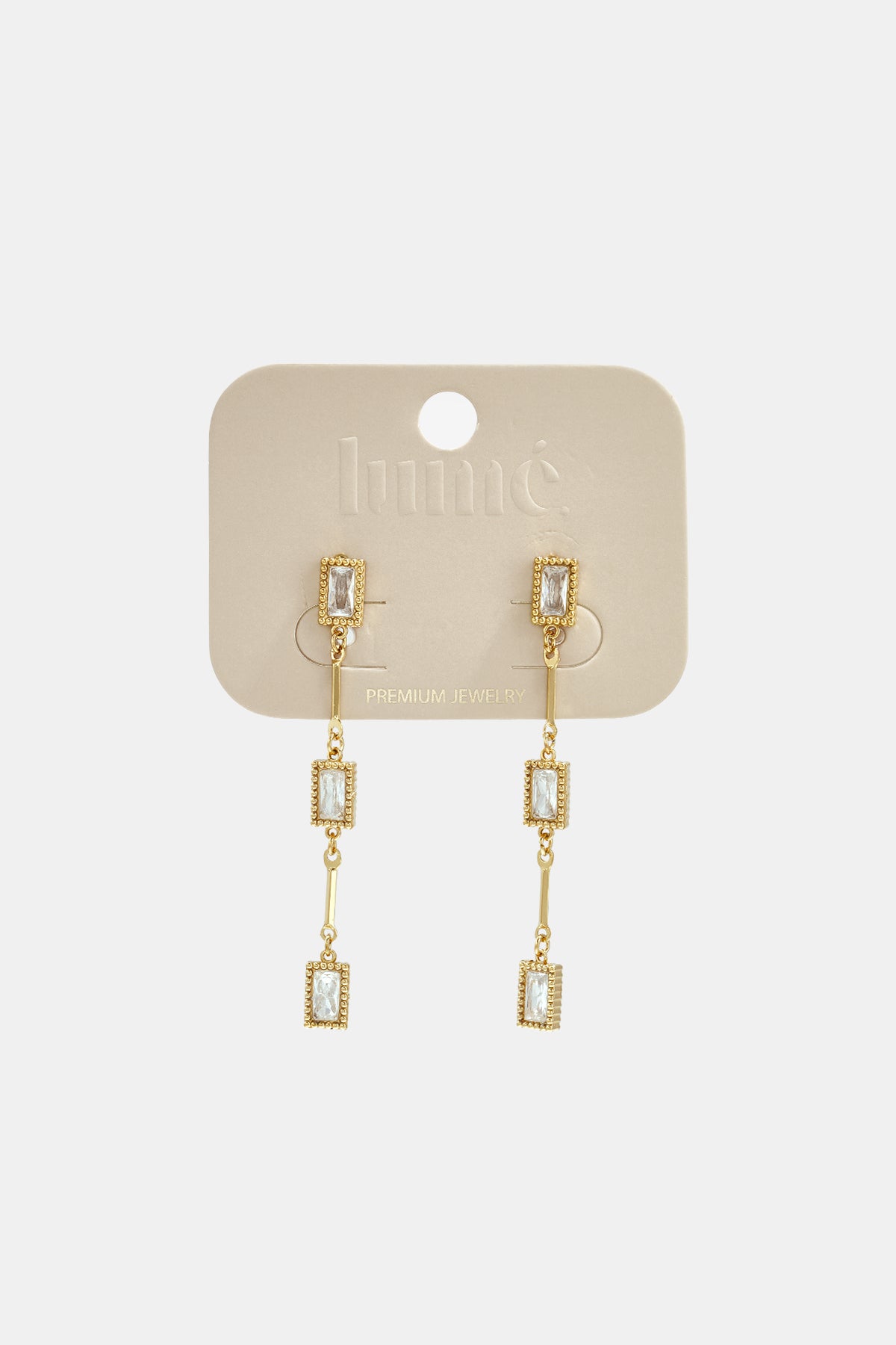 Gold Elara Geometric Earrings with clear rectangular zircon stones and gold chain links.
