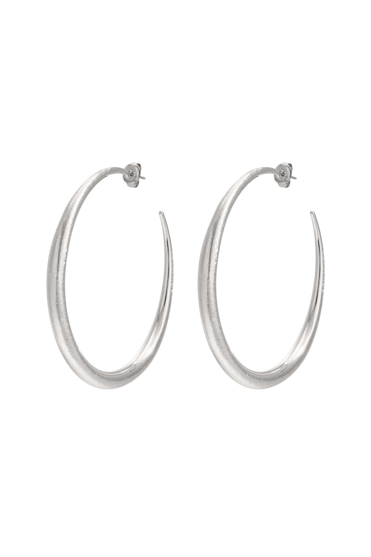 Aurelia Hoop Earrings: A pair of brushed silver hoop earrings with a subtle curve and post backing.